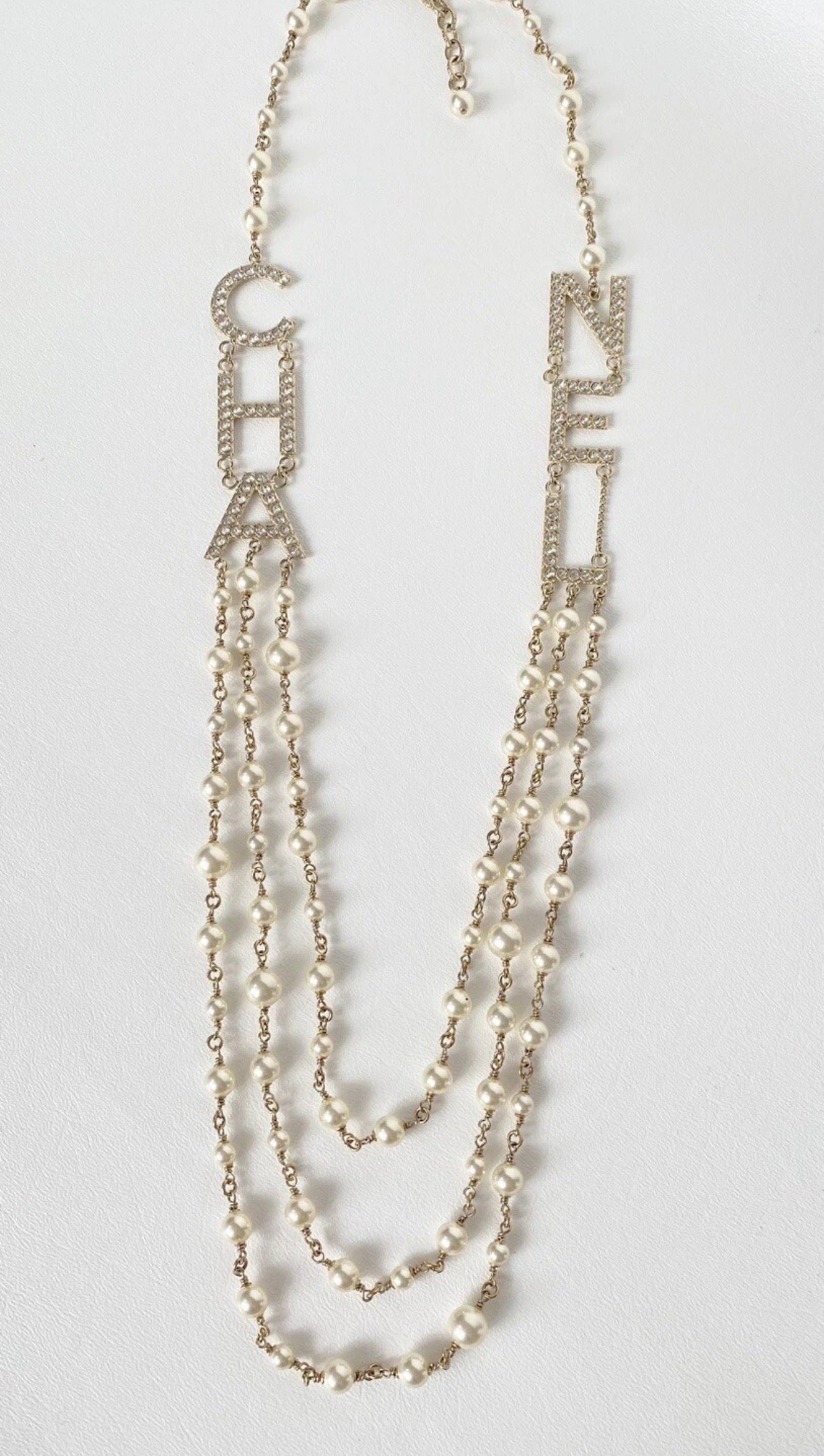 CHANEL 2019S GOLDEN TONE CHA NEL LETTERS LOGO WITH CRYSTALS PEARLS LONG NECKLACE