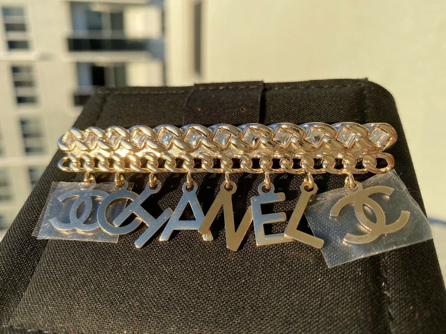 CHANEL GOLD "CHA"NEL" CC LOGO WHITE CRYSTALS CHARMS BROOCH PIN