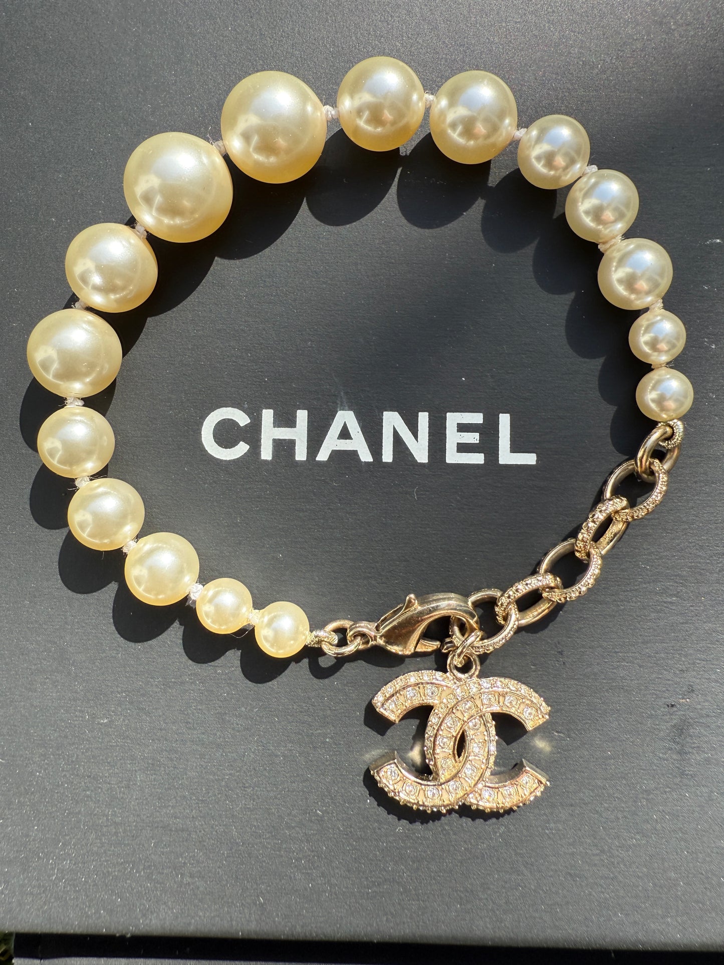 Chanel 19V Graduated Pearl Pearls Crystal Crystals CC Logo Charm Pendant Gold Tone Bracelet