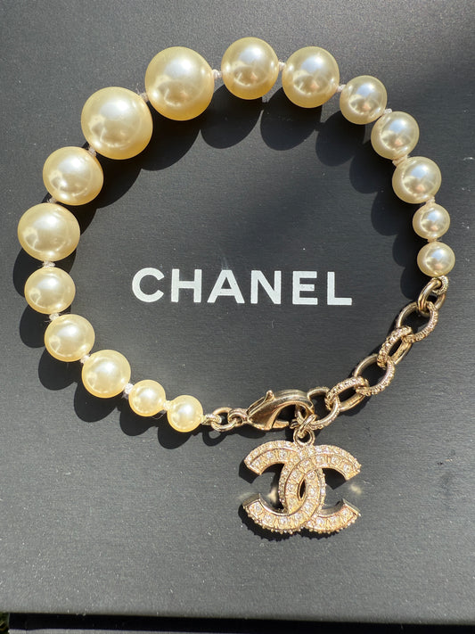 Chanel 19V Graduated Pearl Pearls Crystal Crystals CC Logo Charm Pendant Gold Tone Bracelet