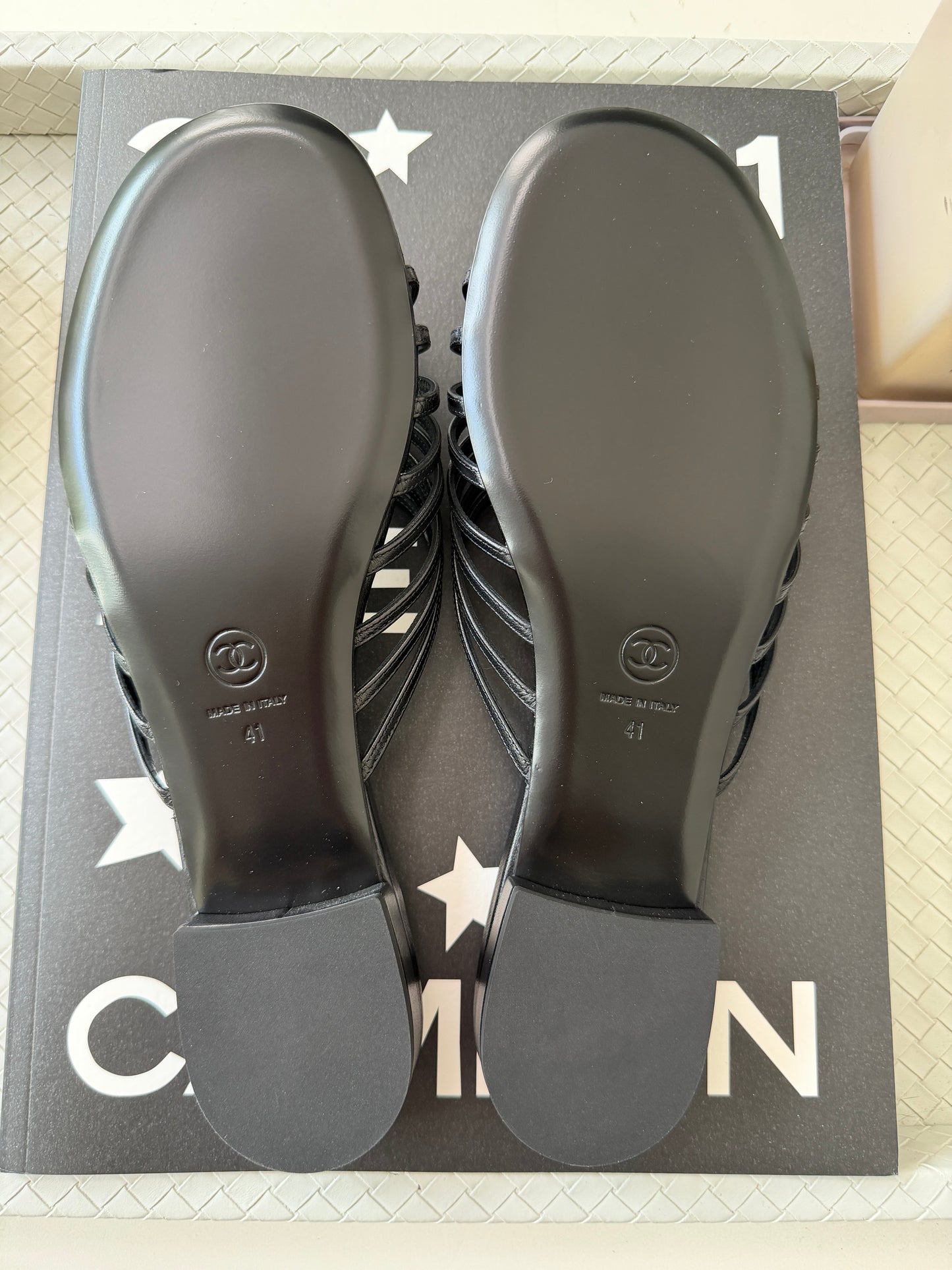 Chanel 2026 Métiers d'Art Blazy Black Leather Strappy Gold CC Logo Flat Sandals Slides