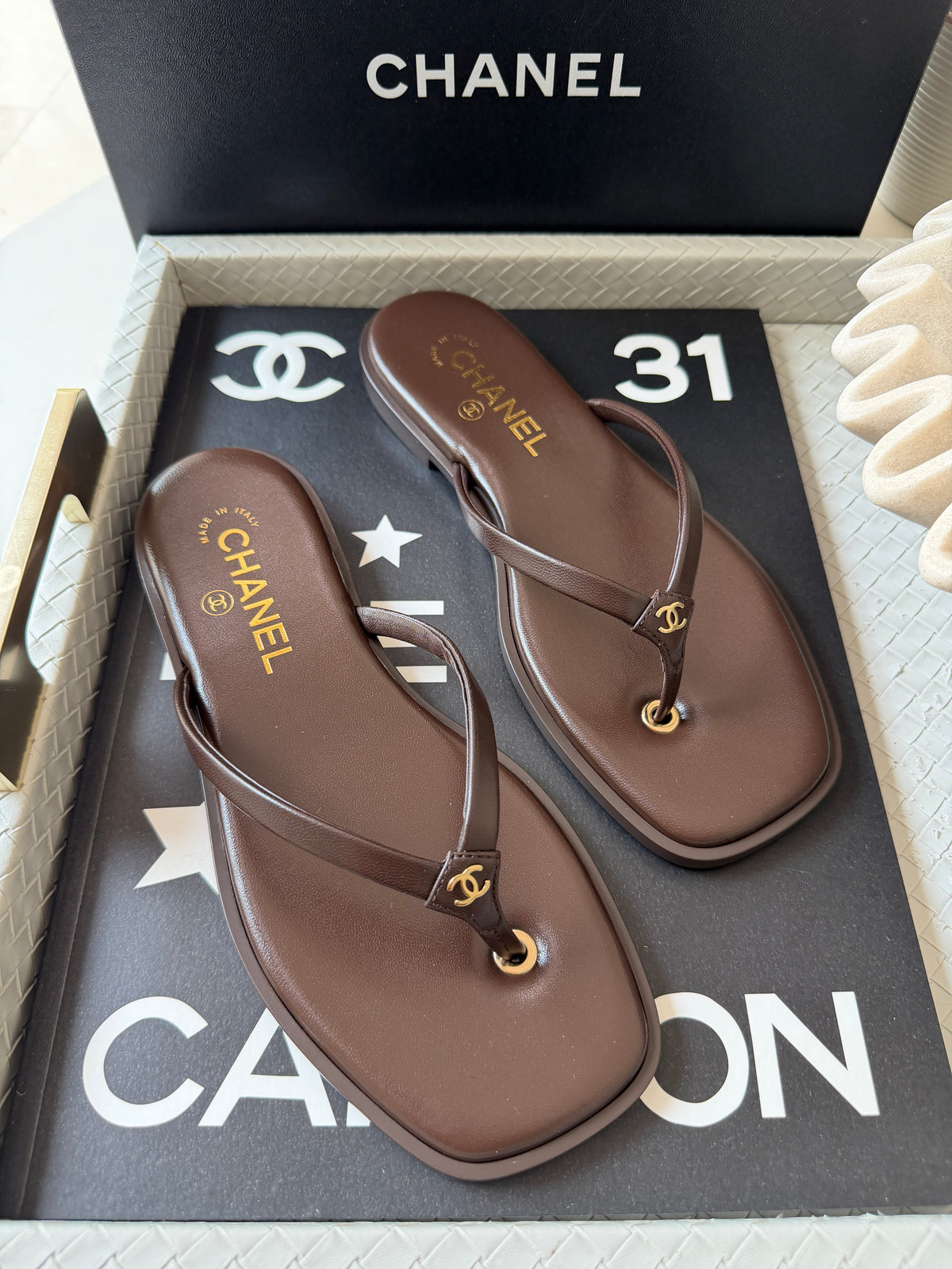 Chanel 2026 MÉTIERS D’ART Brown Leather Gold CC Logo Flip Flops Slides Flat Sandals Thongs 26A
