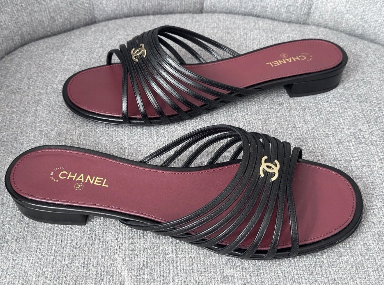 Chanel 2026 Métiers d'Art Blazy Black Leather Strappy Gold CC Logo Flat Sandals Slides