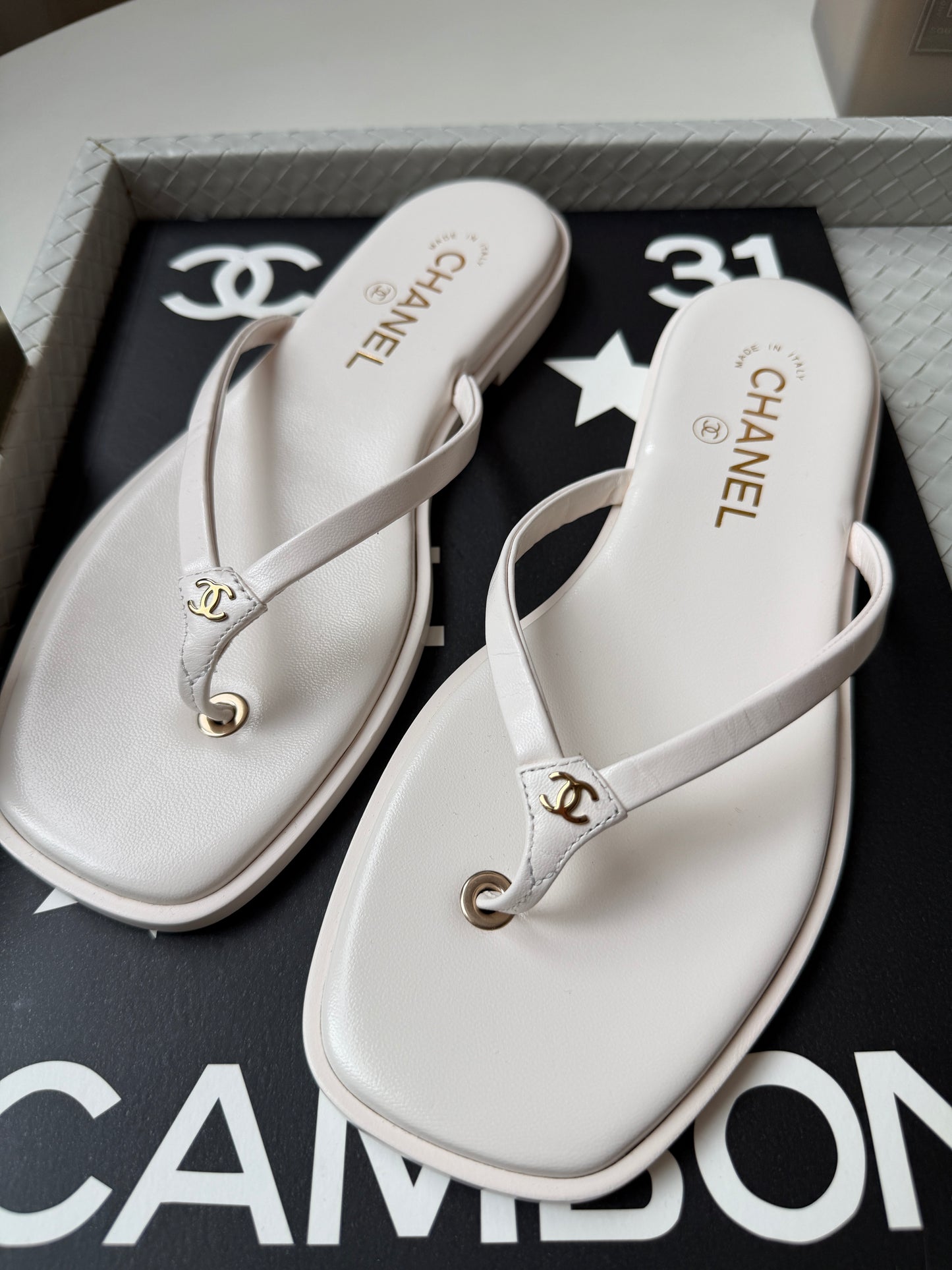 Chanel 2026 MÉTIERS D’ART Ivory White Leather Gold CC Logo Flip Flops Slides Flat Sandals Thongs