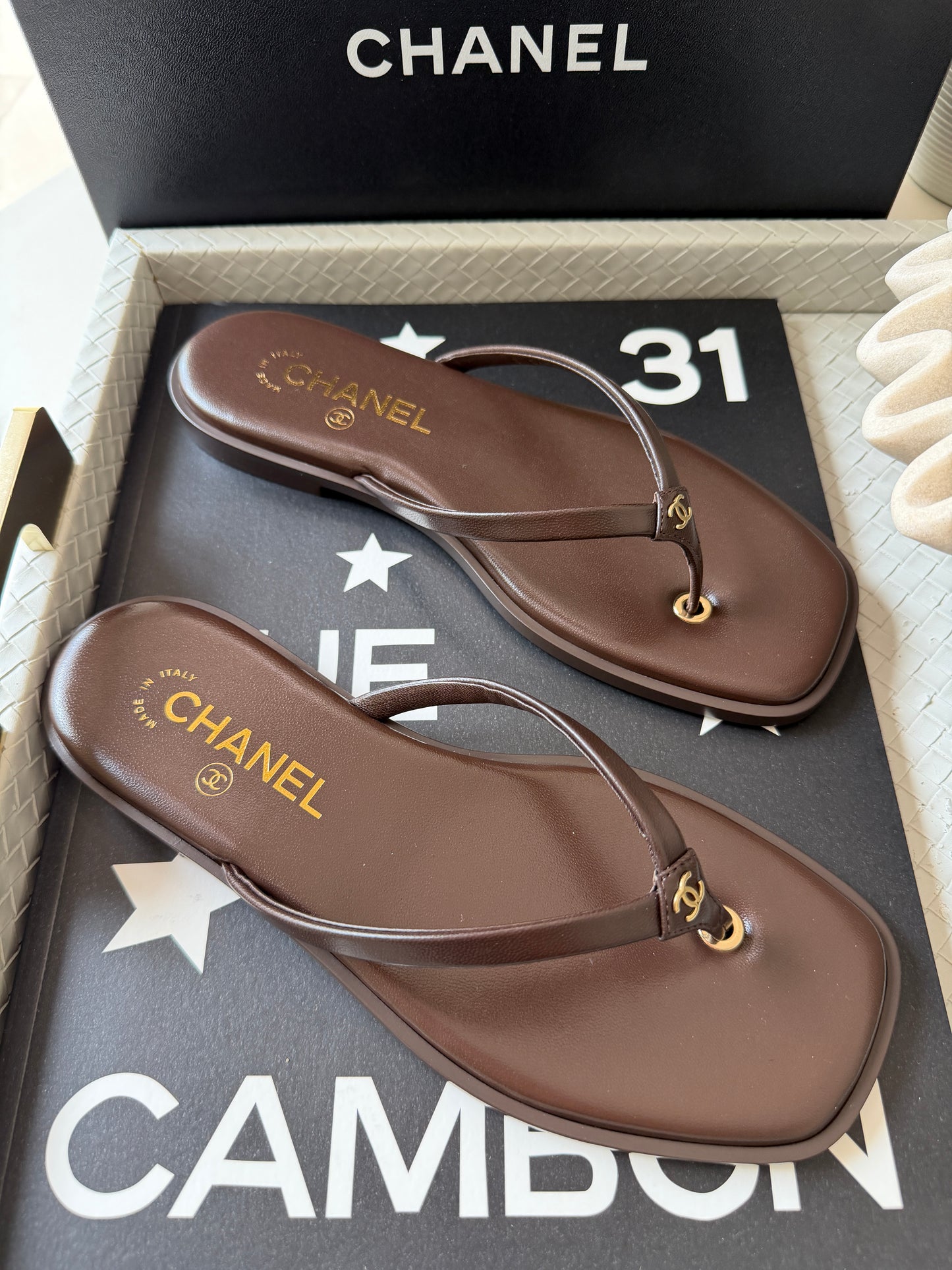 Chanel 2026 MÉTIERS D’ART Brown Leather Gold CC Logo Flip Flops Slides Flat Sandals Thongs 26A