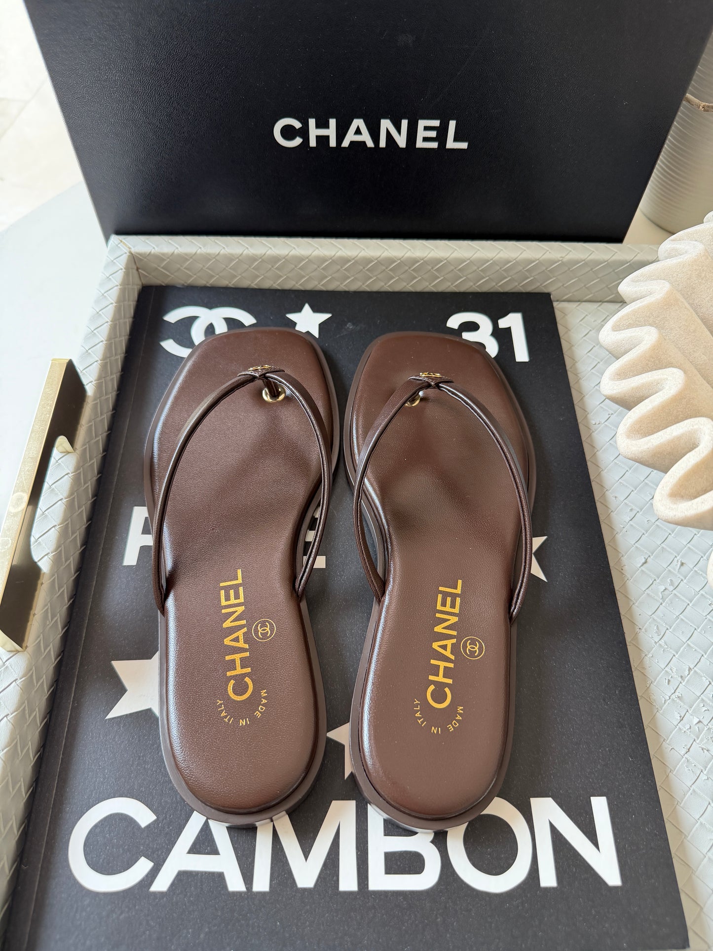 Chanel 2026 MÉTIERS D’ART Brown Leather Gold CC Logo Flip Flops Slides Flat Sandals Thongs 26A