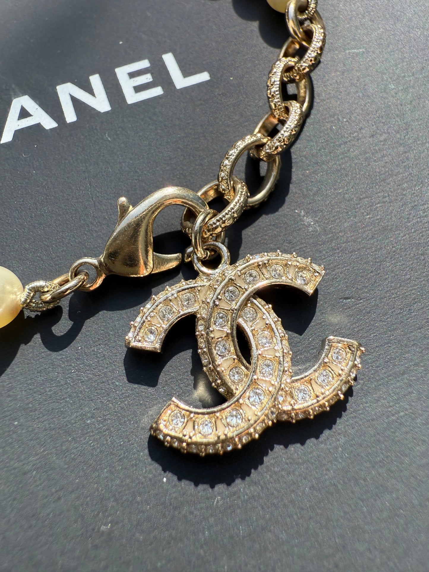 Chanel 19V Graduated Pearl Pearls Crystal Crystals CC Logo Charm Pendant Gold Tone Bracelet