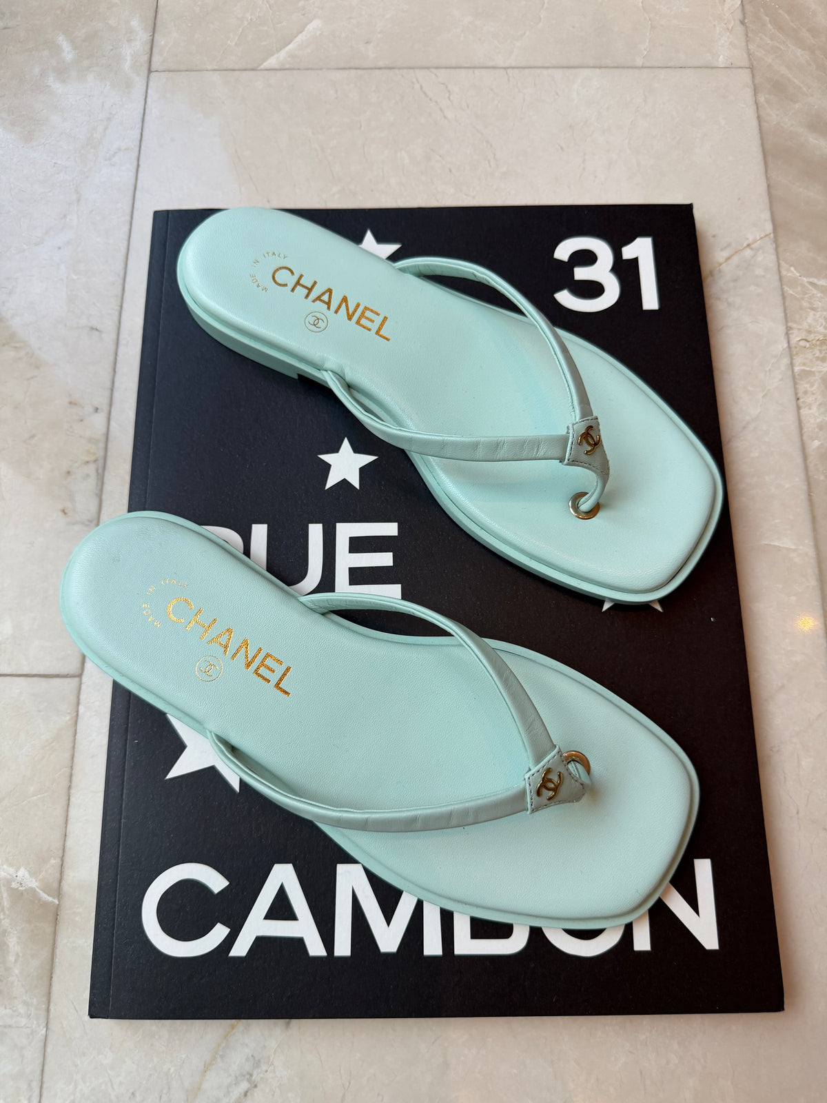 Chanel 2026 MÉTIERS D’ART Turquoise Leather Gold CC Logo Flip Flops Slides Flat Sandals Thongs