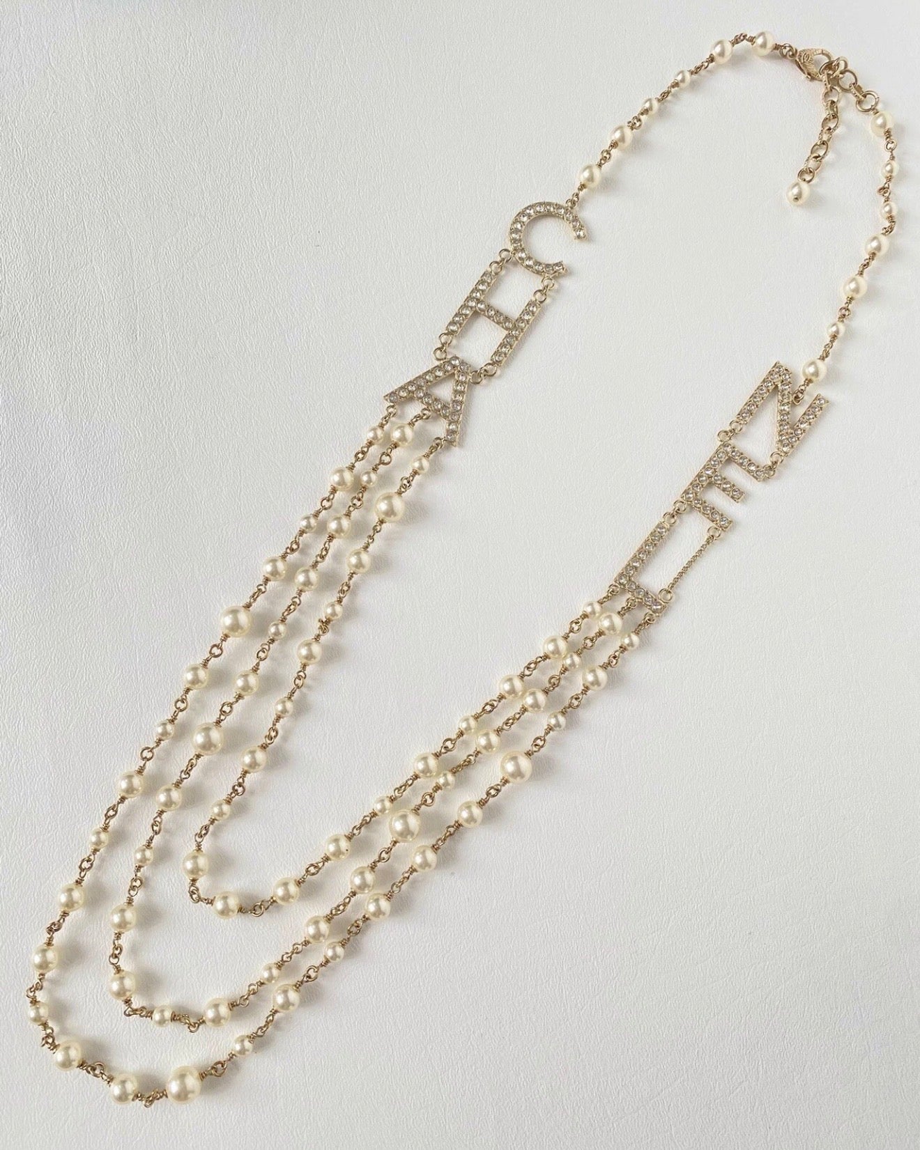 CHANEL 2019S GOLDEN TONE CHA NEL LETTERS LOGO WITH CRYSTALS PEARLS LONG NECKLACE