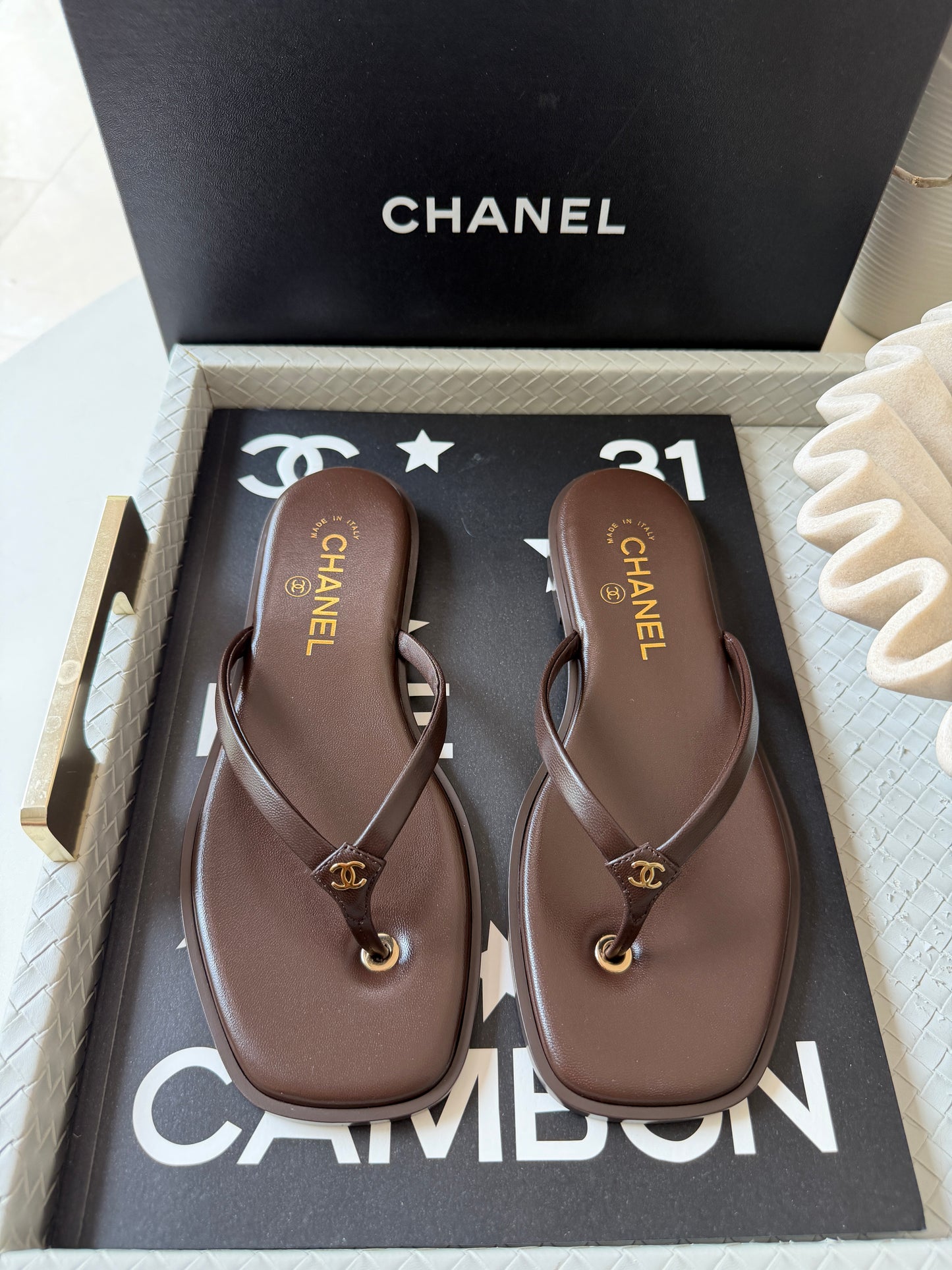 Chanel 2026 MÉTIERS D’ART Brown Leather Gold CC Logo Flip Flops Slides Flat Sandals Thongs 26A