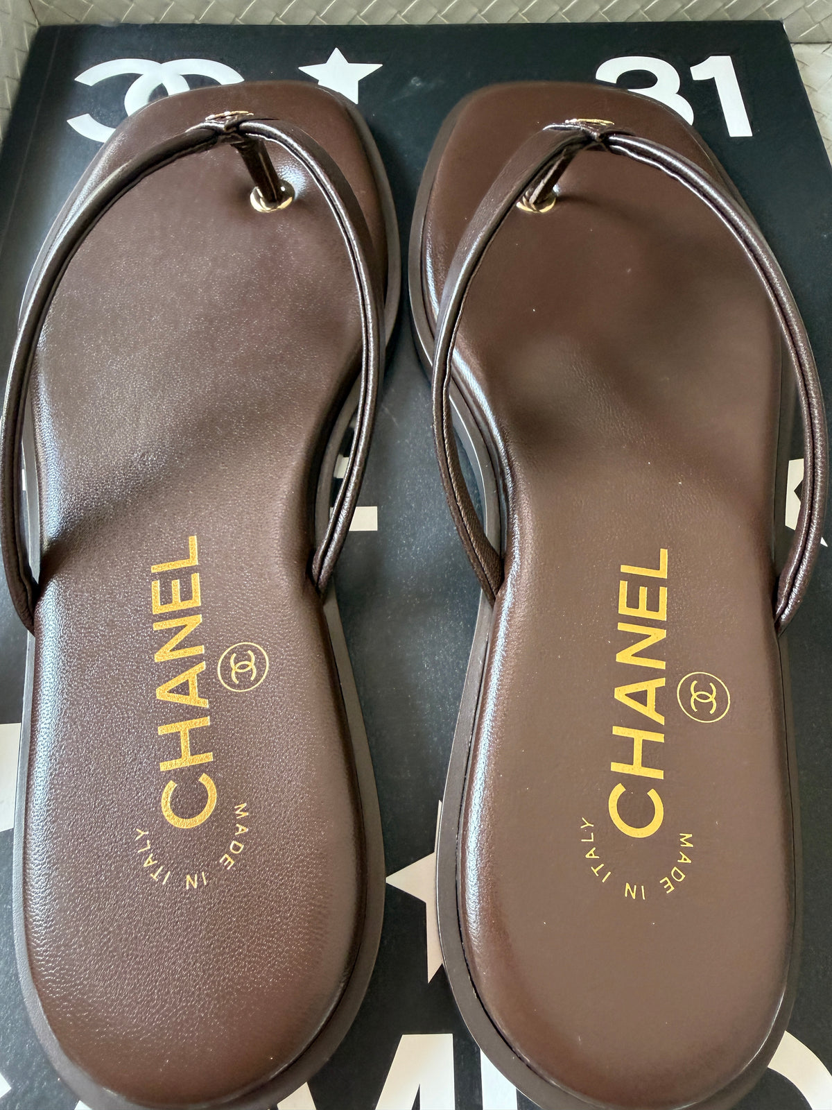 Chanel 2026 MÉTIERS D’ART Brown Leather Gold CC Logo Flip Flops Slides Flat Sandals Thongs 26A