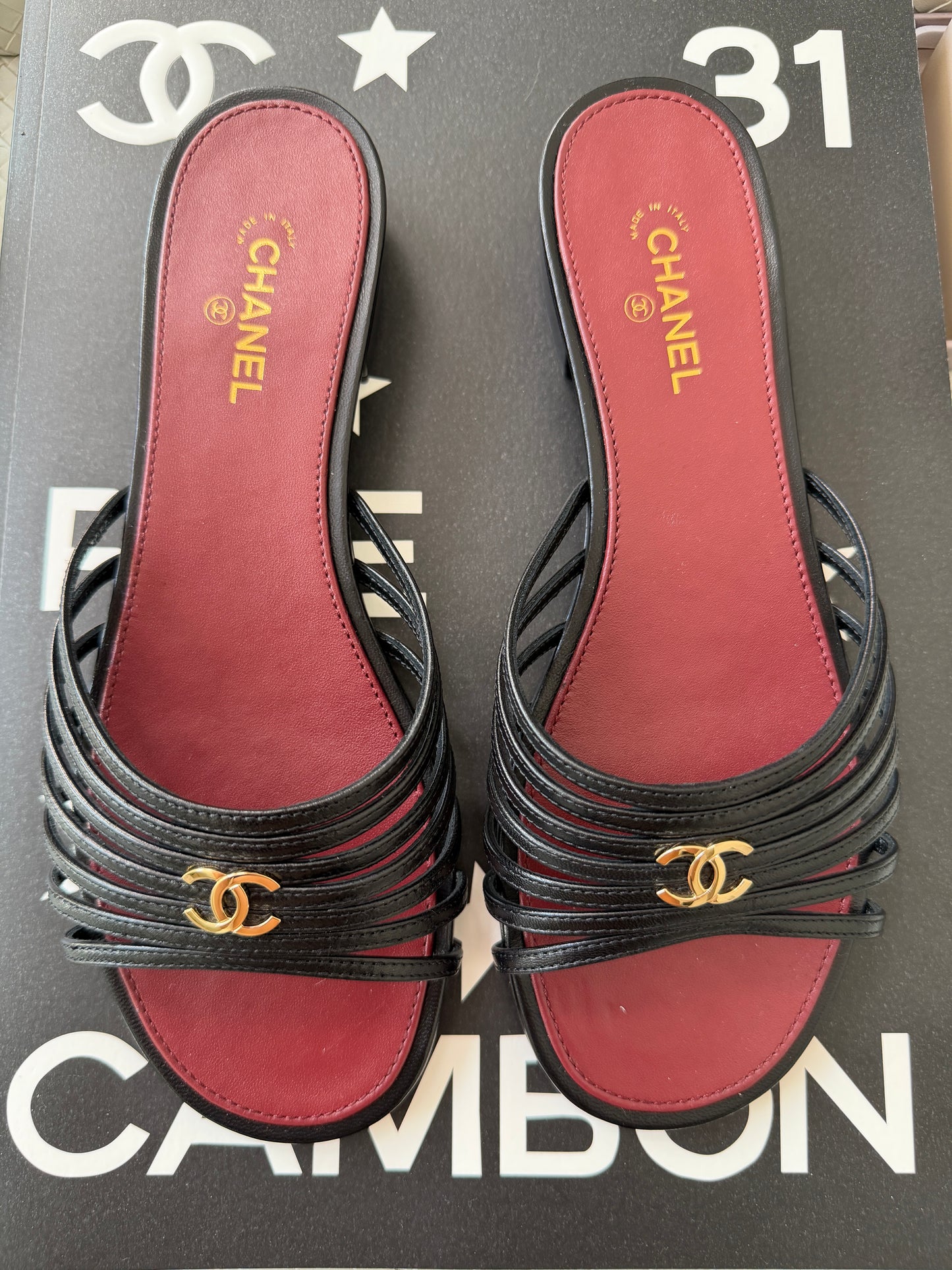 Chanel 2026 Métiers d'Art Blazy Black Leather Strappy Gold CC Logo Flat Sandals Slides