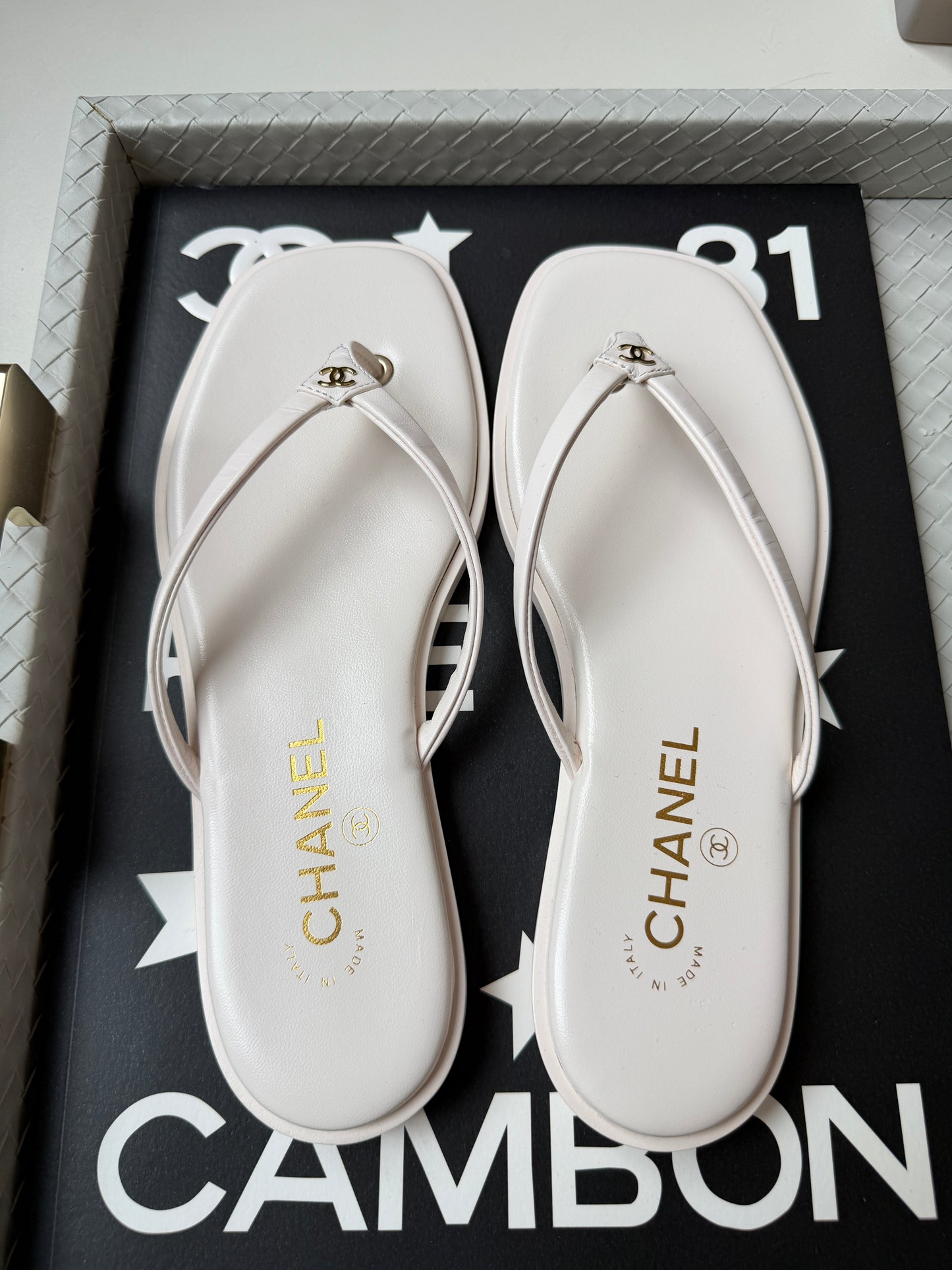Chanel 2026 MÉTIERS D’ART Ivory White Leather Gold CC Logo Flip Flops Slides Flat Sandals Thongs
