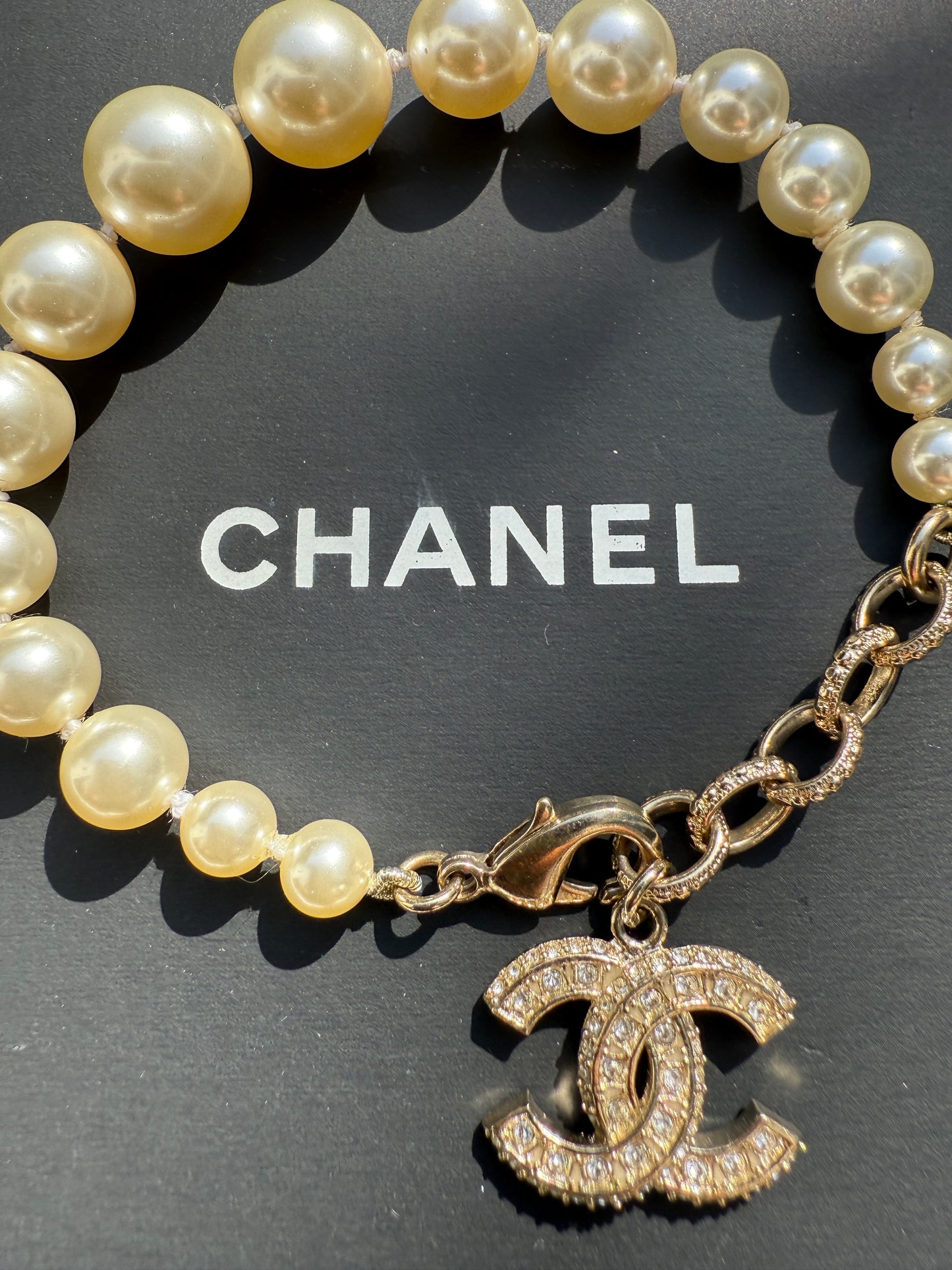 Chanel 19V Graduated Pearl Pearls Crystal Crystals CC Logo Charm Pendant Gold Tone Bracelet