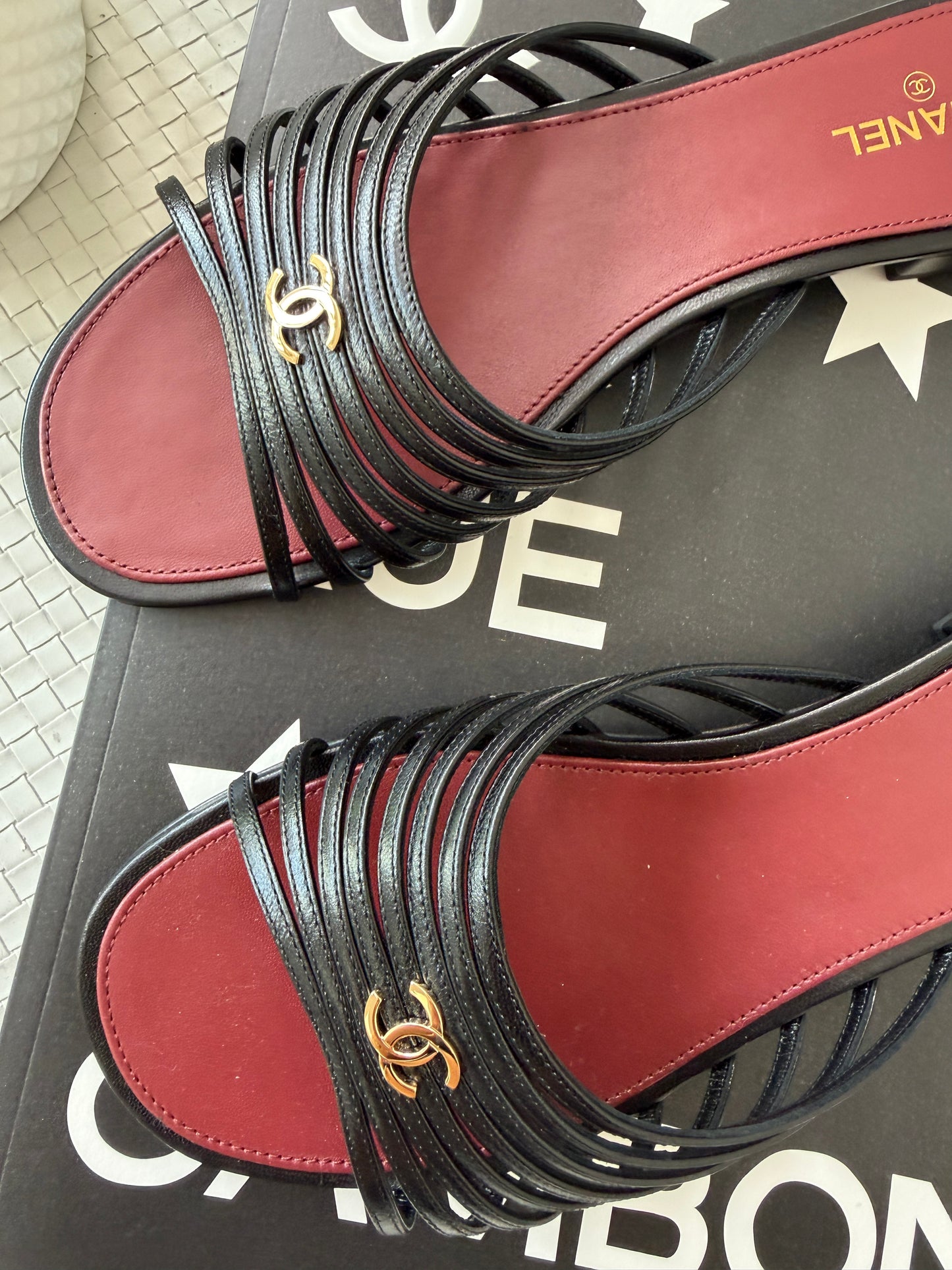 Chanel 2026 Métiers d'Art Blazy Black Leather Strappy Gold CC Logo Flat Sandals Slides