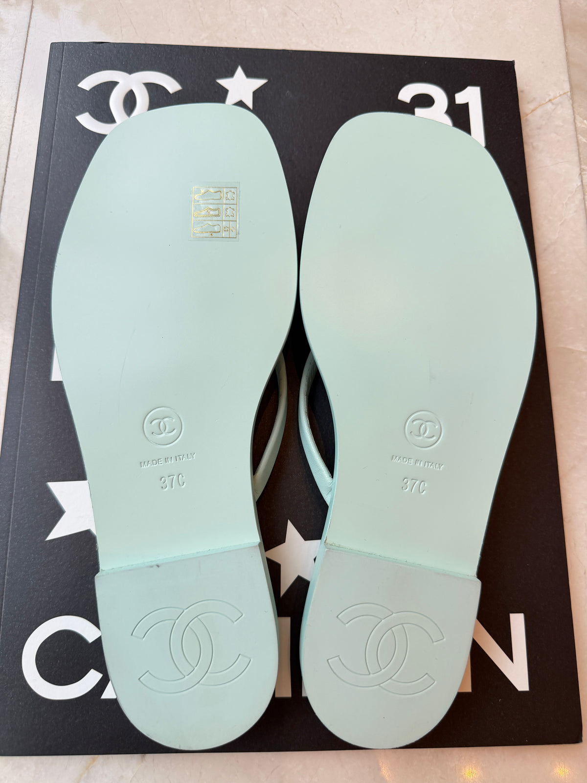 Chanel 2026 MÉTIERS D’ART Turquoise Leather Gold CC Logo Flip Flops Slides Flat Sandals Thongs