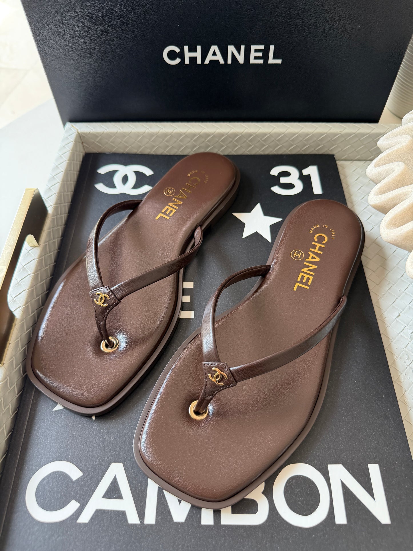 Chanel 2026 MÉTIERS D’ART Brown Leather Gold CC Logo Flip Flops Slides Flat Sandals Thongs 26A