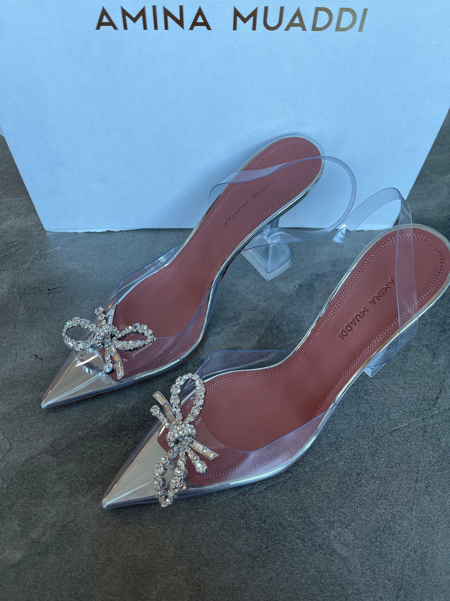 Amina Muaddi Rosie PVC Clear Transparent Bow Crystal Embellished Pumps