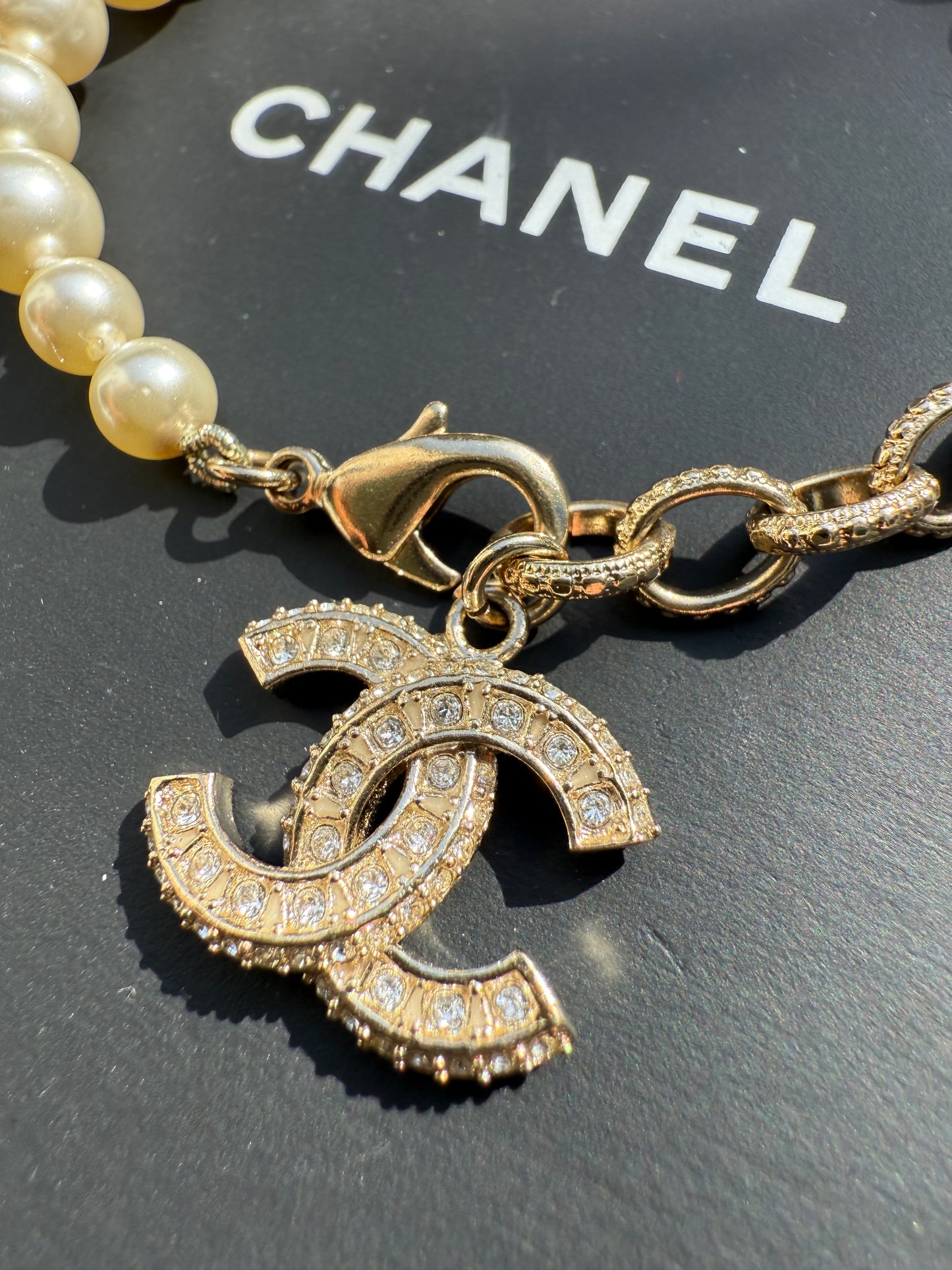 Chanel 19V Graduated Pearl Pearls Crystal Crystals CC Logo Charm Pendant Gold Tone Bracelet