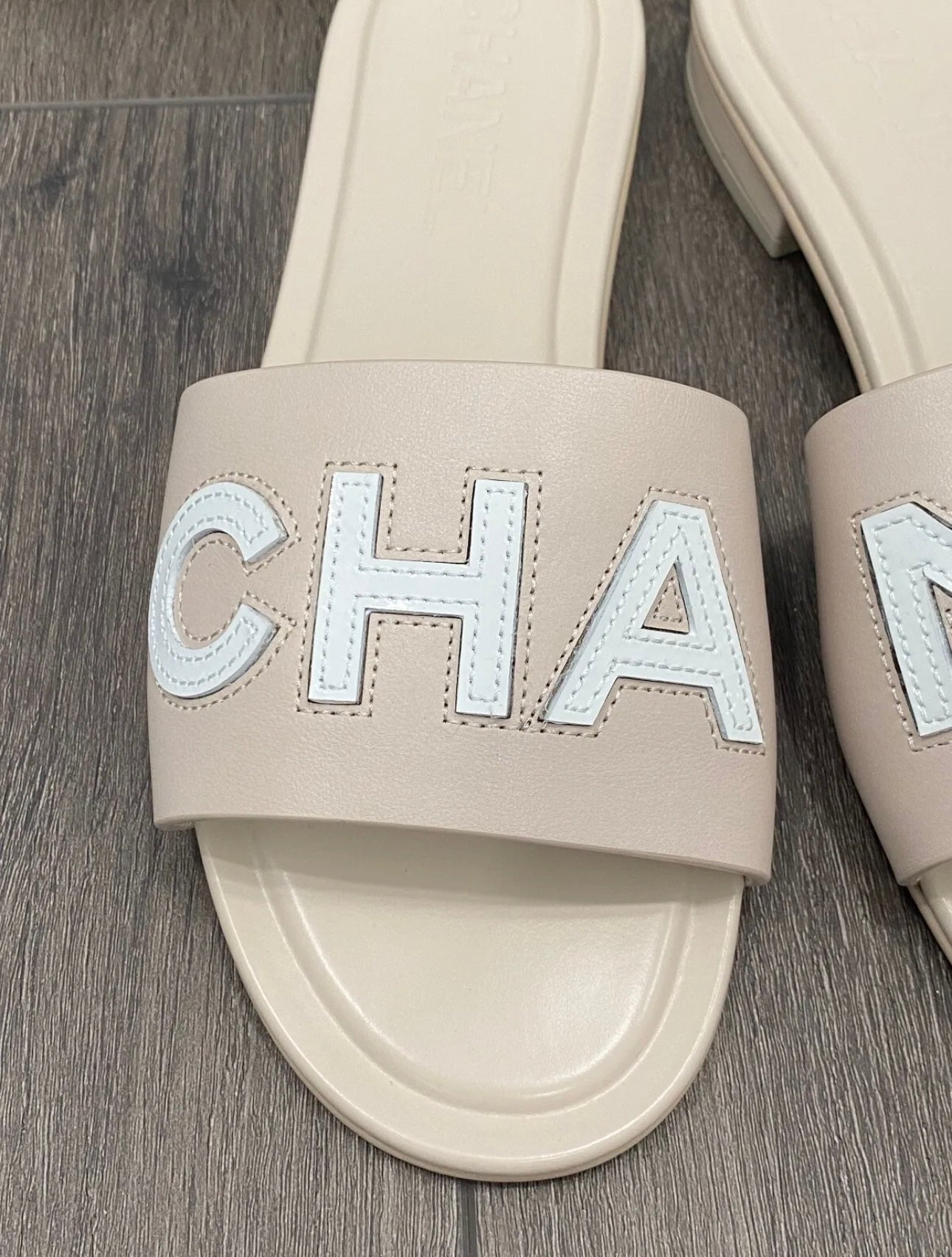 CHANEL CHA NEL LOGO BEIGE LEATHER FLAT SHOES SLIDES MULES – Miami Lux  Boutique