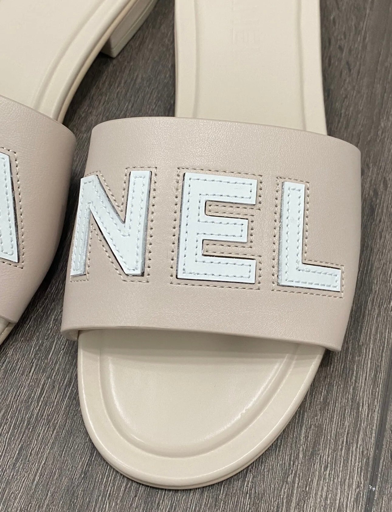 CHANEL CHA NEL LOGO BEIGE LEATHER FLAT SHOES SLIDES MULES – Miami Lux  Boutique