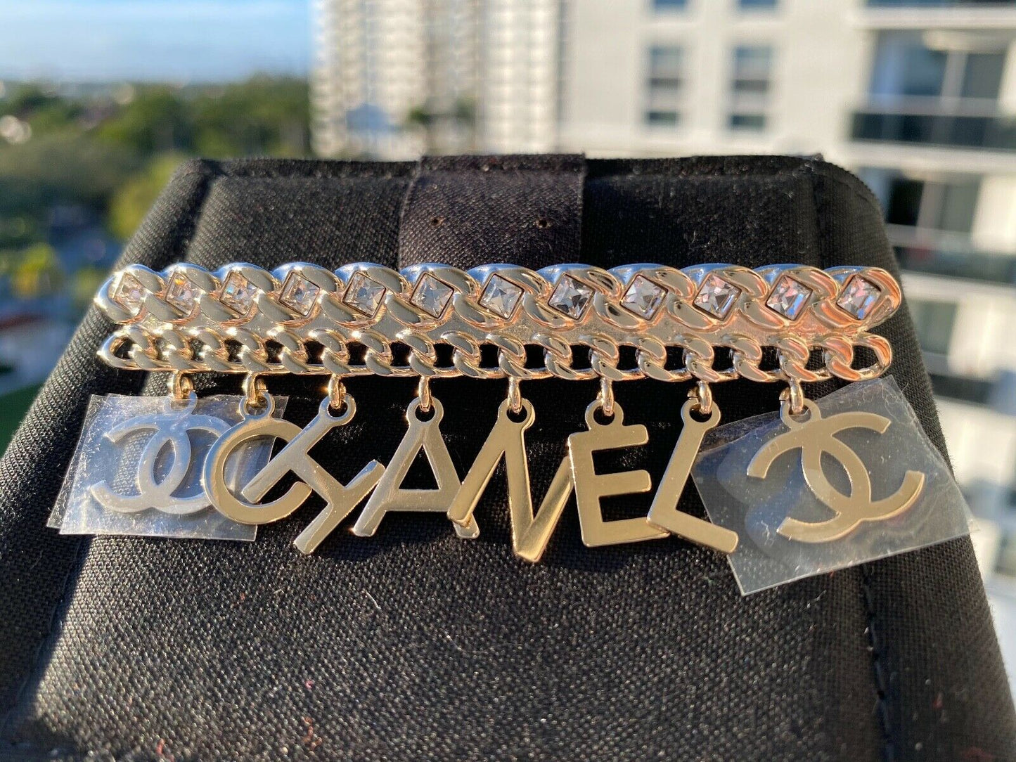 CHANEL GOLD "CHA"NEL" CC LOGO WHITE CRYSTALS CHARMS BROOCH PIN
